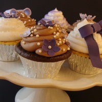 Flowers & Bows Pretty cupcakes decorated with gumpaste flowers & bows, sprinkles, and sugar pearls.
