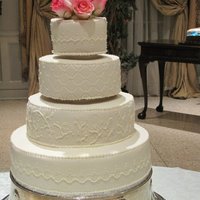 Buttercream Impressions Buttercream iced cake with buttercream piping.