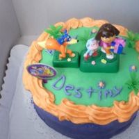 Dora The Explorer Cake We made this 8" double layered cake and 3 dozen cupcakes a few weeks ago for a birthday party.