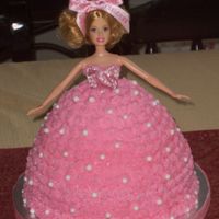 Barbie Cake Barbie cake for a little girls party. Vanilla with buttercream icing with ediable pearls.