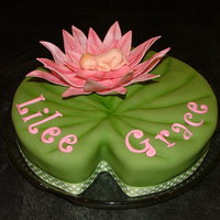 Lilee Pad Water Lily to welcome my new little neice Lilee Grace. Single layer 10 inch, carved and covered in fondant. Brushed with powders colors to...