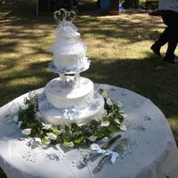 Blue Themed Wedding The cake was French Vanilla, with a baileys filling, and whipped cream frosting. The decor is a light blue ribbon around the bottom with...