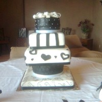 Black And White Wedding Cake This cake was for my little sisters wedding with a black and white theme. The first tier is a dummy square cake with a dotted design. The...