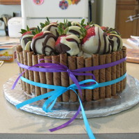 Strawberries I got this idea from a cake on here. It's a cake covered with buttercream icing and chocolate and white chocolate covered strawberries...