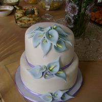 Jamie's Cake Here's a cake I made for a friend's bridal shower. It's covered in MMF with MMF calla lilies. The calla lilies were...