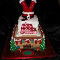 2010 Christmas Cake Christmas cake I did for our family get together. Bottom tier, Chocolate cake w/ choc. chips filled with Mint butter cream w/ mini choc....