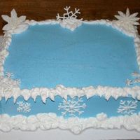 Snowflake Cake This cake was so much fun! Yellow cake with buttercream frosting. Snowflakes are royal icing and a few are fondant.