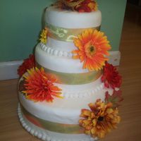 Fall Theme This was my first wedding cake. It is a 6, 8 12" rounds with wired ribbon and contrasting flowers.It was a blast and I cant wait to do...
