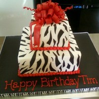 Tim's Cake This was inspired by Sweetcakes. Lemon raspberry cake, lemon buttercream, fondant stripes and bow. TFL!