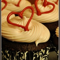 Cupcake Love Chocolate cupcakes with buttercream/cream cheese frosting and candy melt hearts
