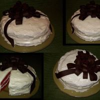 Red Velvet Present This is my first decorated cake! It is covered in cream cheese icing and a big bow made out of modelling chocolate. It was so much fun to...