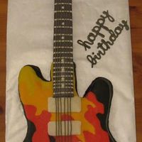 Guitar With Flames Guitar with flames. I didn't mean the little knobs to look like eyeballs...it just so happened that way. All buttercream, except neck...