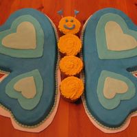Blue Butterfly Blue butterfly for a 9 yr old girl's bday. I baked a 6 inch and 9 inch heart for the wings. Body is 4 cupcakes. This one was super fun...