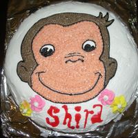 Curious George Cake I printed out a big picture of Curious George and traced it with a toothpick onto crusted buttercream. Then I filled it in with a star tip...