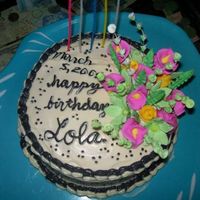 A Grandmother's 75Th Birthday Buttercream.. gumpaste flowers (store-bought).. I gotta work on my writing skills..