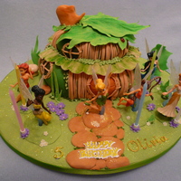 Tinkerbell's House tinkerbell's house and fairies( purchased toys) surrounding the cake house.