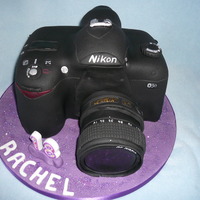 Camera Cake Madiera sponge 3D cake covered in fondant paste modelled into a digital slr camera.