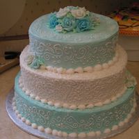 Turquoise And White.... Yuck Not my first choices of colors... This cake was so frustrating. It had been raining for days when I made the icing... humidity was a big...