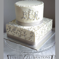 25Th Wedding Anniversary This is a 6" round with a 8" square turned sideways. All buttercream, piping painted with silver dust.