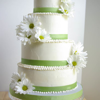 Simple Daisies This was a 4,6,8,and 10 (but had to carved it down because of some baking issues) Carrot cake with cream cheese filling and vanilla...