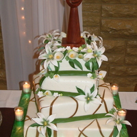 July 10Th Wedding Cake The top three tiers are real cake, white cake with an Almond Extract, buttercream under the Marshmallow Fondant. The bottom tier is a dummy...
