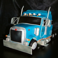 Peterbilt Semi Truck Sculpted cake, covered with MMF, rice kripsy treats for the wheels, and for the little details I used gum paste and edible paint