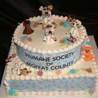 Humane Soceity Party All the litte figurines are made from gum paste and the patter that is on the side of the cake was printed onto edible sheet with edible...