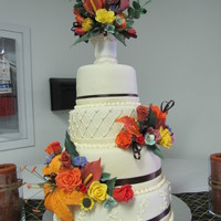 Pocono Autumn Wedding WASC cake filled with apricot/pineapple jam, covered in ganache and then MMF. Gumpaste flowers. This cake was for a close family friend who...