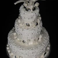 2Nd Wedding Cake Chocolate mud cake with choc rasp fillng, covered in fondant, silver dragees and silver almond... from a picture the bride sent to me.