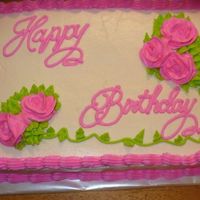 Birthday Cake Chocolate cake with buttercream frosting. It was so hot and humid that day that my roses and frosting melted a little.