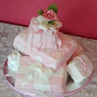 Julianna Fondant covered "packages" with fondant/gum paste ribbons to celebrate her 1st birthday. Rose is gum paste