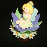 Tinkerbell Cupcake Tinkerbell and flowers are gumpaste, the grass is buttercream.