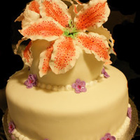 Stargazer Birthday Cake This was a cake I made for my DH's grandmother's birthday. I handmade and painted the stargazer lilies from gumpaste. The cake is...