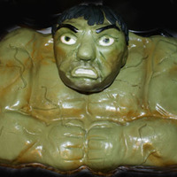The Hulk The cake is the body covered in green dyed fondant. The head is hand sculpted rice krispy treats (home made) with molding chocolate for...