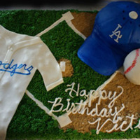 Dodger Theme Cake I made this cake for my step father's birthday. He is a HUGE Dodgers fan. I made it from a sheet cake covered in butter cream (grass...