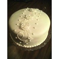 White Cake This is my first fondant covered cake. It's a butter pecan cake with buttercream icing. Covered in white fondant and buttercream...