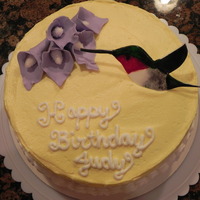 Hummingbird Gum Paste Hummingbird and flowers made from gum paste. Hummingbird hand painted with gel colors. Cake is vanilla sponge with vanilla buttercream.