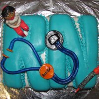 Rn Graduation Cake A graduation cake for a friend who became an RN;Strawberry cake w/ BCF filling and covered in BCF and fondant. Lettering, RKT covered in...