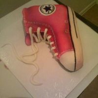 Converse Pic A vannilla Cake with BC Icing and Covered with homemade fondant. The colors were sprayed on and shoe strings were also made with fondant.