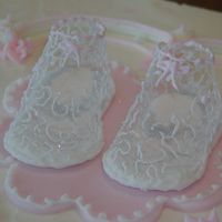 Baby Girl Butter cream iced with fondant/gum paste bow and ribbons.