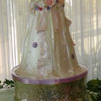 Out Side Of The Lines... This towering cake design was chocolate and white layers with alternating fillings of fudge, strawberry and butter cream. Fondant draping...