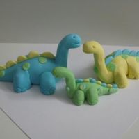 Gumpaste Dinosaurs For Baby Shower Cake We made these for a Baby Shower im working on for this weekend. All gumpaste.