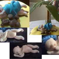 Fondant Baby Boy With Blanket Baby Troy was made out of fondant/gumpaste mix for a baby shower cake.