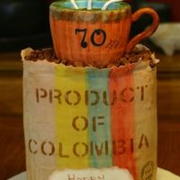 Coffee Bag Cake I made this cake for my dad 70th birthday. Is a 4 tier cake sculpted to look like a coffee bag. The mug is also cake and the coffee beans...