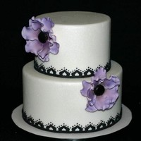 Purple And Black Wedding Cake Yes, I love anemones. I made the anemones pink and the I dusted them with purple and black petal dust.