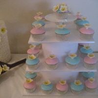 Frangipani Baby Shower Cakes Caramel mud cakes with pink and blue fondant icing with yellow frangipani. Custom built stand. For a friends baby shower with a summer...