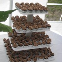 232 Mini Chocolate Mudcake 232 mini chocolate cupcakes with buttercream icing and silver balls. For a friends wedding