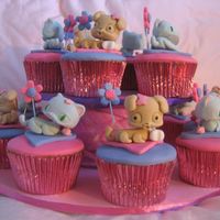 Littlest Pet Shop Cupcakes Hand moulded Littlest pet shop dog and cat on Vanilla dairy free cupcake for a kids party. Took ages but was lots of fun. Hand made stand...