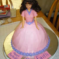 Doll Cake Buttercream icing, fondant decorations, bodice is fondant. First time making a doll cake.