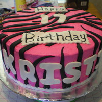 Hot Pink Zebra Strawberry, choclate cake, covered in strawberry frosting, fondandt stripes.
